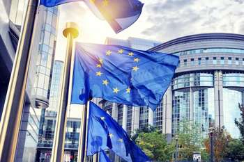 Photo credit: EU flags waving in front of European Parliament building. Brussels, Belgium